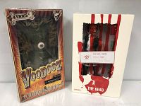 Boxed Voodooz Kennis and The Dead Biohazard collectible figures side by side.