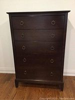 Front view showing five drawers and ring pulls