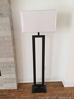 Front view showing full lamp including base, body, and shade