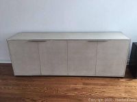 Front view, closed four-door facade