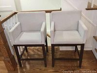 Front view of both bar stools on hardwood floor