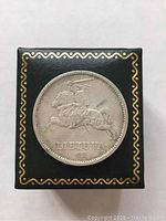 Front side of the 1936 10 Litu coin showing a knight on horseback with 'LIETUVA' and date 1936.