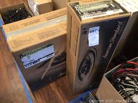 Two original American Standard Williamsburg boxes containing a pedestal sink top and pedestal base, stacked side-by-side showing box labels.