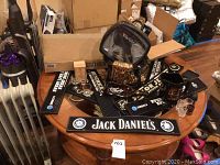 Photo showing bar mats and various accessories on a round wooden table.