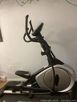 Full side view of elliptical showing frame and console