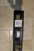 Closed black case with combination locks and handle, labelled Solingen