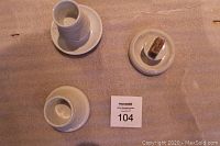 Lot of 3 antique earthenware matchstick strikers grouped on table showing overall condition and size comparison