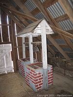Decorative wishing well planter in loft setting