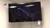 Samsung 40 inch flat-screen TV mounted on wall