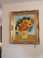 Full view of the framed oil painting showing sunflowers