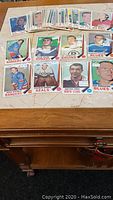 Collection of 39 1969/70 O-Pee-Chee hockey cards spread out on a table showing various players and teams.