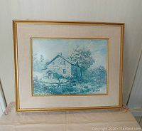 Framed Keirstead print titled 'Snook Farmhouse' showing an early Ontario stone farmhouse with surrounding nature and signature in lower right.