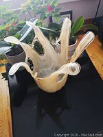 Front view of Murano glass vase showing artistic finger-like extensions and glossy finish