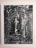 Front view of the black and white abstract oil painting with textured surface in simple frame.