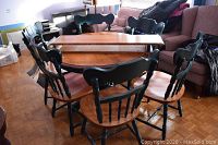 Full view of table with both leaves installed and six chairs surrounding