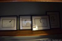 Four framed art prints by Benjamin Chee Chee displayed together