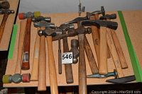 Overhead view of all hammers and mallets arranged on a table