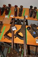 Overview of two large jointer planes on shelf among smaller planes