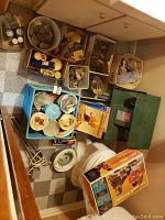 Overhead view showing machines, boxes of rocks, jars and kit