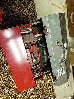 Exterior view of closed grey metal toolbox with handle