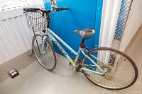 Full side view of the light blue Norco Yorkville ladies bicycle showing the frame and flat tires.