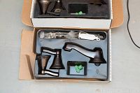 Two boxed sets of Moen Rothbury bathroom faucets in oil-rubbed bronze finish, displayed open with components visible.