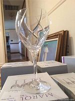 Front view of an open Mikasa crystal water goblet glass displaying diamond-cut pattern on the bowl.