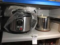 Princess brand digital crockpot and metal melting pot on shelf