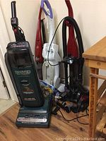 Four cleaning machines grouped, showing overall size and relative appearance.