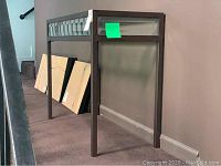 Side view of metal framed foyer table without glass top shown, illustrating overall dimensions and frame structure.