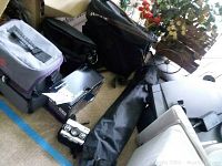 Overall view of lot showing printer, camera cases, bags, tripod bag and trays on floor
