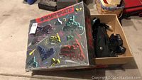 Box labeled 'Roadskate' showing rollerblading theme with colorful rollerblade graphics, indicating original packaging.