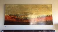 Front view of entire painting mounted on wall, showing full composition of metallic gold and rust-colored bands