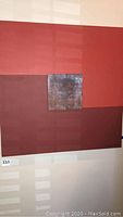 Frontal view of entire 36x36 inch canvas showing red geometric blocks and central panel