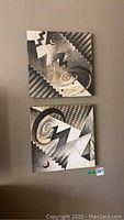 Two 16x16 signed tile art pieces arranged vertically on a wall, showing both full artworks.