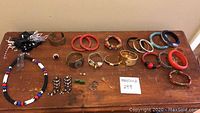 Overhead view of entire lot on wood surface showing assortment of jewelry pieces