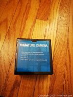 Top view of the box showing product description and features of the miniature camera with Sony advanced CCD sensor.