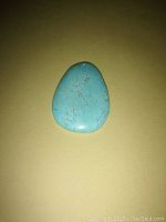 Front view of the large turquoise gemstone pendant showing natural matrix pattern and teardrop shape.