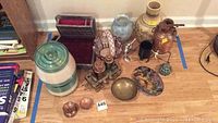 Lot arranged on floor including various vases, copper samovar, bowls, and organizers.