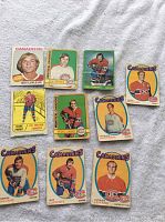 Full view of all 10 Montreal Canadiens hockey cards laid out on fabric showing front face of each card.