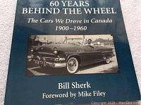 Book cover showing title, author, and vintage convertible car photo