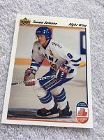 Front photo of 1991-92 Upper Deck Teemu Selanne rookie hockey card showing player in Winnipeg Jets white jersey skating on ice.