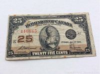 Front view of 1923 Dominion of Canada 25 cents shinplaster note showing overall design, date, serial number and condition.