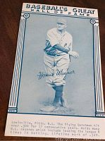 Front of the Honus Wagner baseball postcard showing the player in pitching stance, facsimile signature, and printed player statistics.