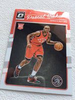 Front image of the 2016 Panini Optic Pascal Siakam Toronto Raptors rookie card showing him dribbling a basketball in the team's red uniform.
