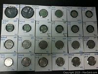 Image showing 24 coins of Holland in sleeves with handwritten date and denomination.