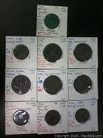 Front view of all 10 ancient Chinese coins mounted on labeled cards with details of date, script style, and condition.
