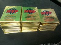 Stacked unopened packets of 1992 McDonalds MVP Donruss baseball cards showing front gold foil packaging and branding.