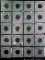 39 Canadian 1 cent coins from 1948 displayed in holders with handwritten varietal notes.