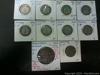 Overview of all ten coins including nine German 5 Pfennig coins and one 1916 German East Africa 20 Heller copper coin.